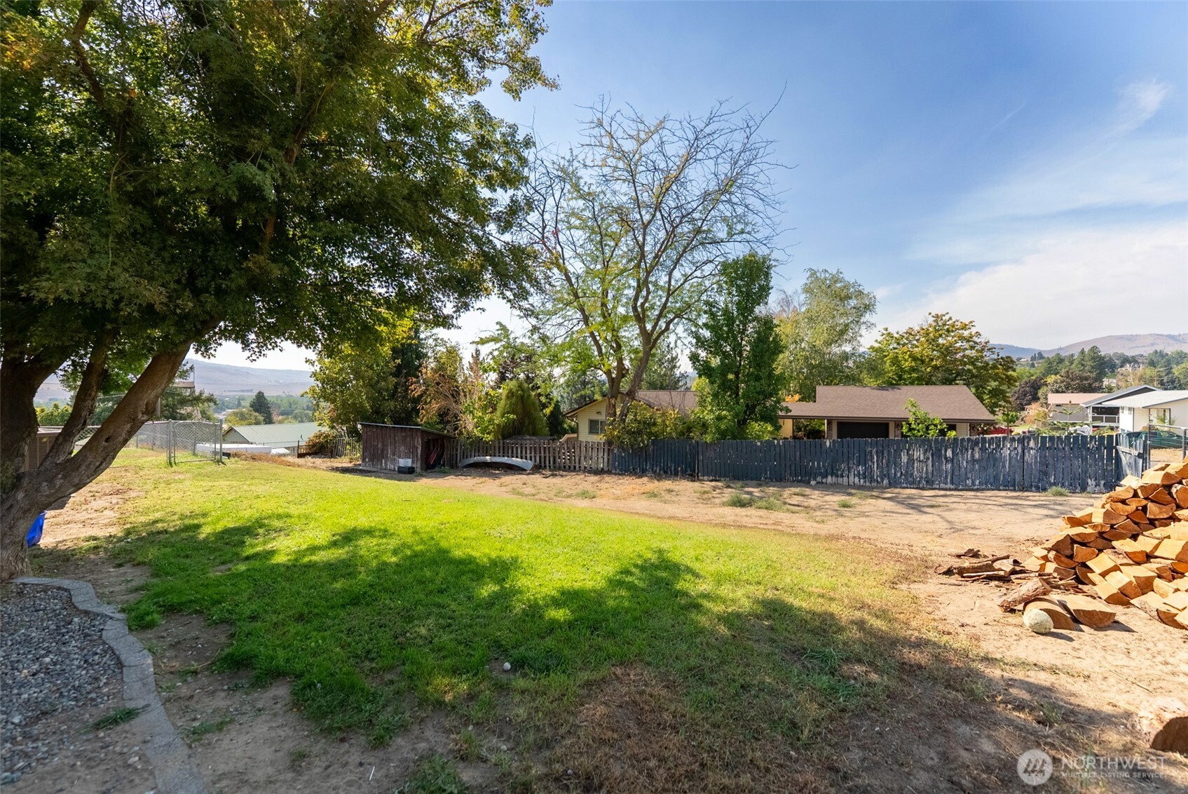 519 Locust Street Omak, WA 98841 - Photo 7 of 33 a view of a swimming pool with an outdoor space and seating area