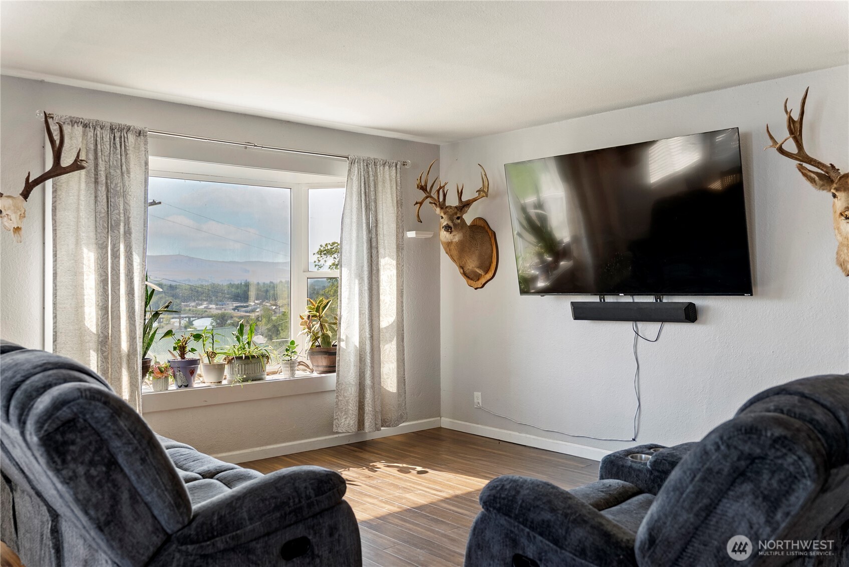 519 Locust Street Omak, WA 98841 - Photo 9 of 33 a living room with furniture and a flat screen tv