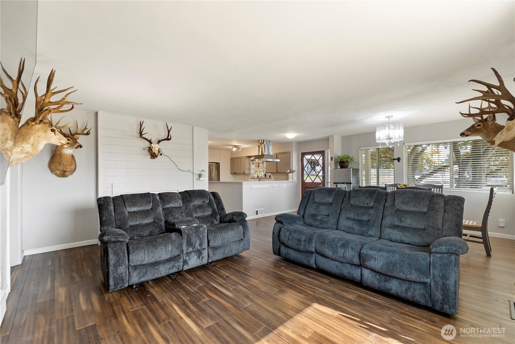 519 Locust Street Omak, WA 98841 - Photo 10 of 33 a living room with furniture and a wooden floor
