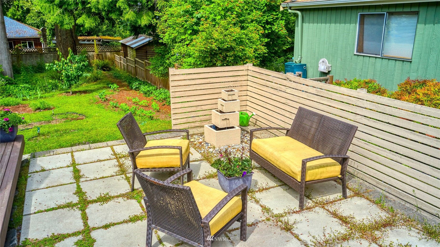 1958 Wellington Road Point Roberts, WA 98281 - Photo 3 of 27 a backyard of a house with table and chairs