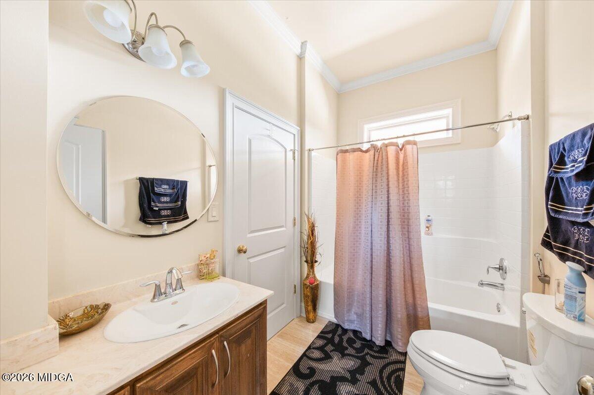 727 Latrobe Way Macon, GA 31220 - Photo 21 of 63 a bathroom with a sink a toilet a shower and a mirror