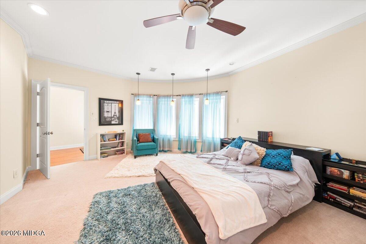 727 Latrobe Way Macon, GA 31220 - Photo 29 of 63 a bedroom with a bed closet and flat screen tv