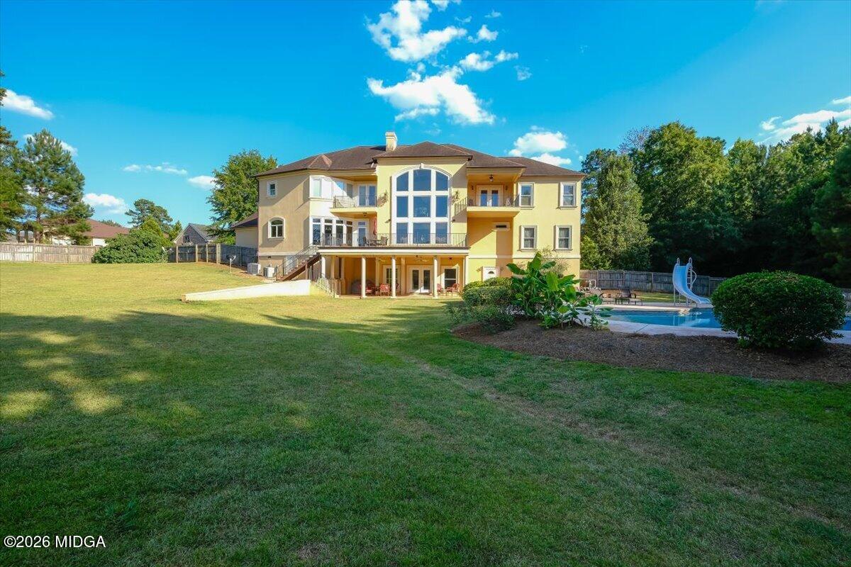 727 Latrobe Way Macon, GA 31220 - Photo 59 of 63 a view of a big house with a big yard plants and large trees