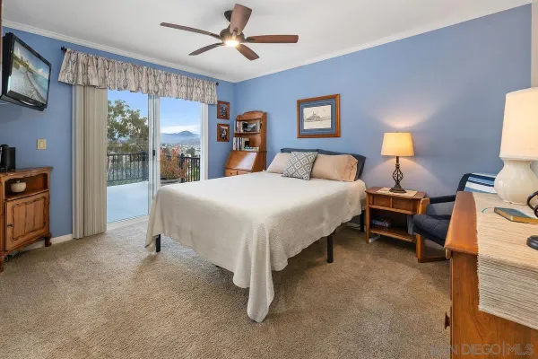a bed room with a bed and a tv