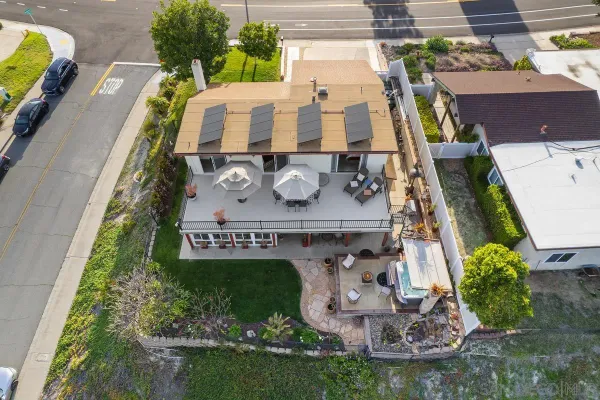 a aerial view of a house with outdoor space swimming pool