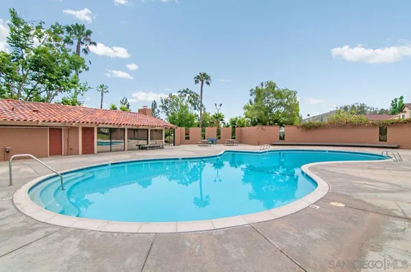 a view of a swimming pool with a patio