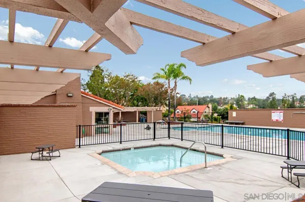 a view of a swimming pool with a lounge chairs