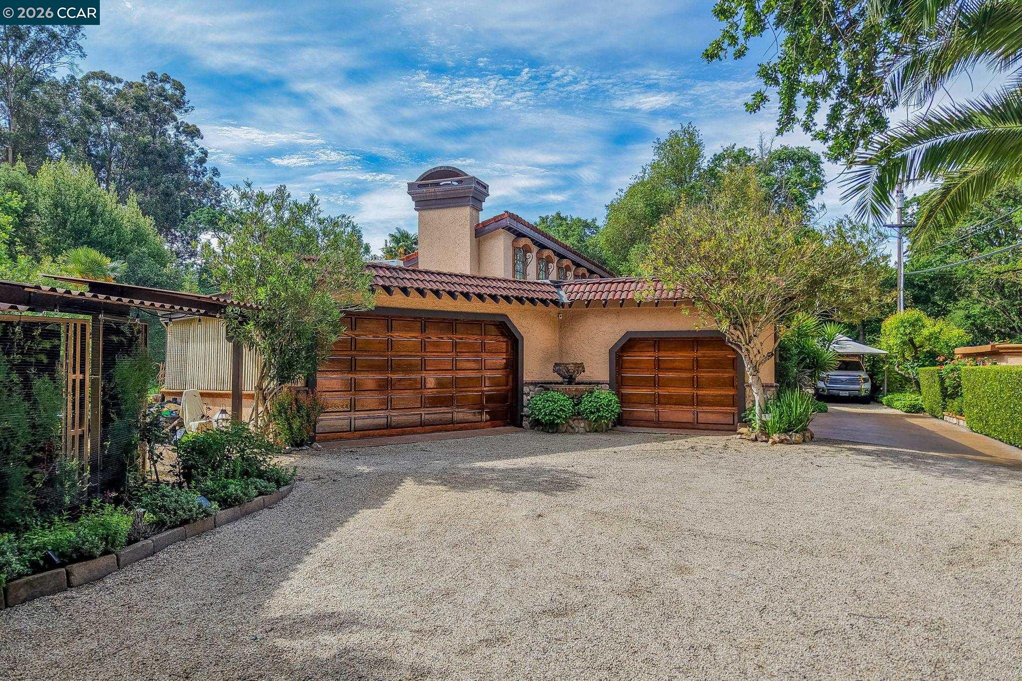 490 St Marys Road Lafayette, CA 94549 - Photo 52 of 61 a view of a house with a yard and garage