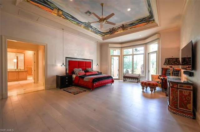 a bed room with a bed and a television