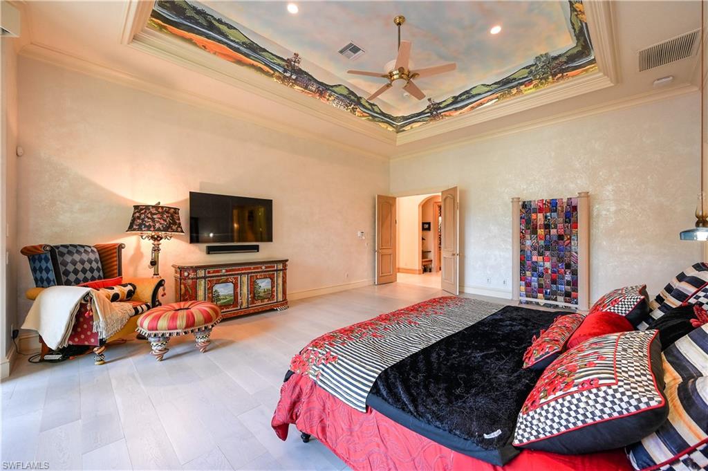 683 Hickory Road Naples, FL 34108 - Photo 20 of 42 a bed room with a bed and a television