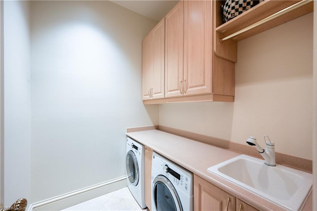 683 Hickory Road Naples, FL 34108 - Photo 24 of 42 a utility room with dryer and washer