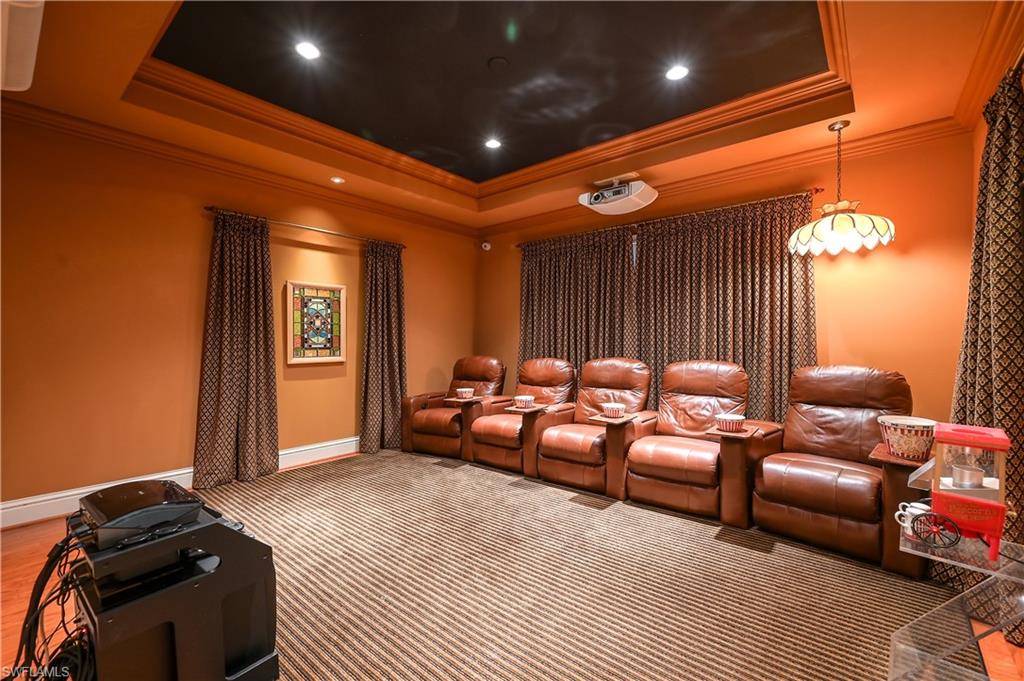 683 Hickory Road Naples, FL 34108 - Photo 25 of 42 a living room with furniture a ceiling fan and a rug