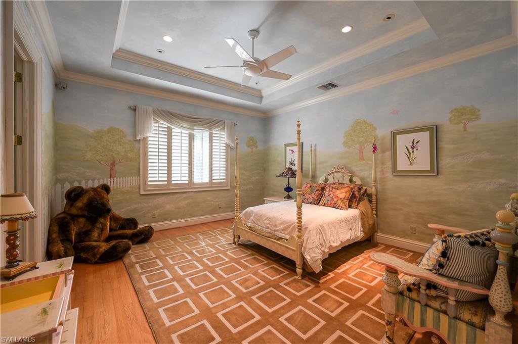 683 Hickory Road Naples, FL 34108 - Photo 27 of 42 a spacious bedroom with two beds and painting on the wall