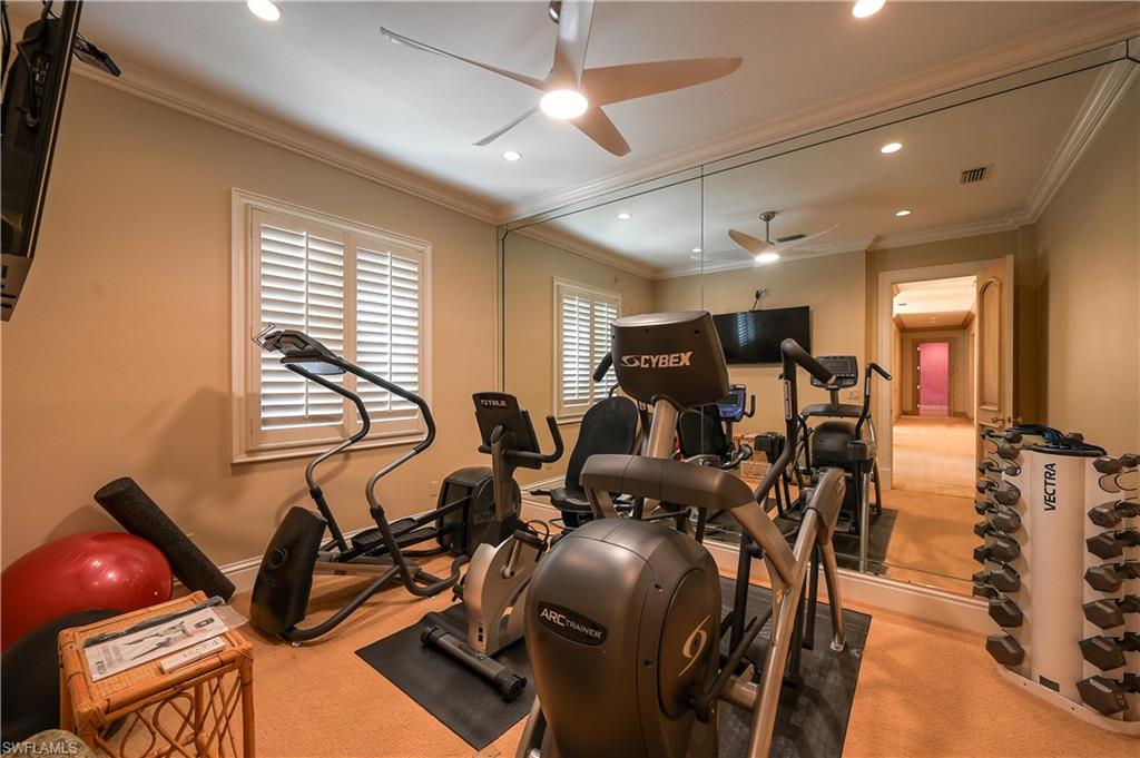 683 Hickory Road Naples, FL 34108 - Photo 28 of 42 a room with gym equipment and window