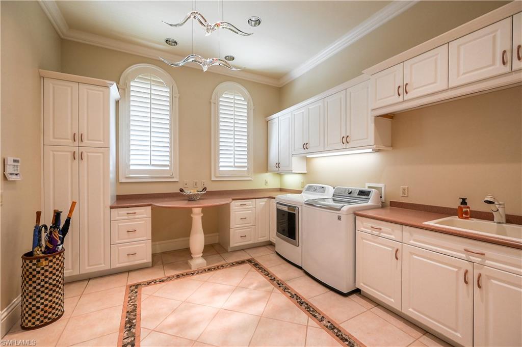683 Hickory Road Naples, FL 34108 - Photo 29 of 42 a kitchen with a stove a sink and a refrigerator