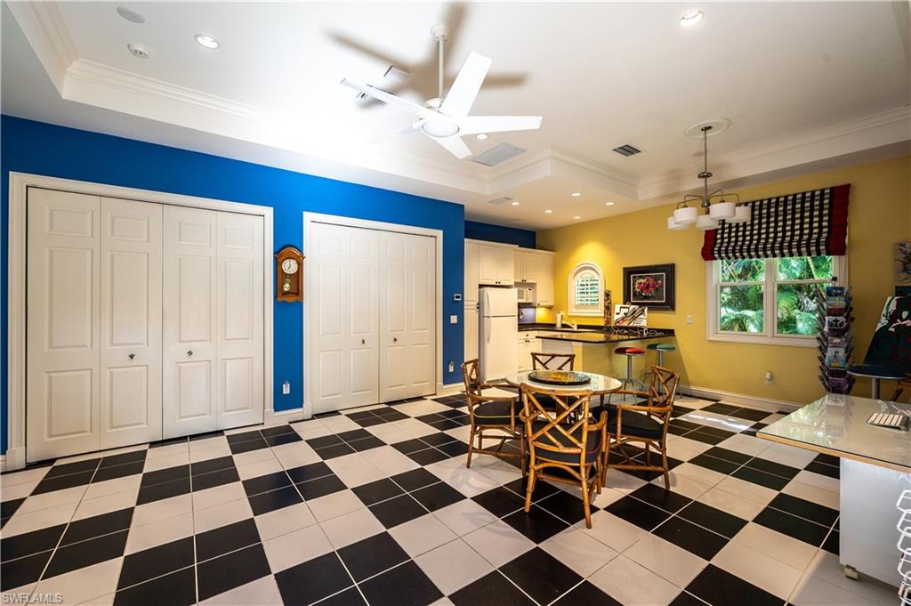 683 Hickory Road Naples, FL 34108 - Photo 31 of 42 a living room with a black white checkered floor with couches chair and a coffee table