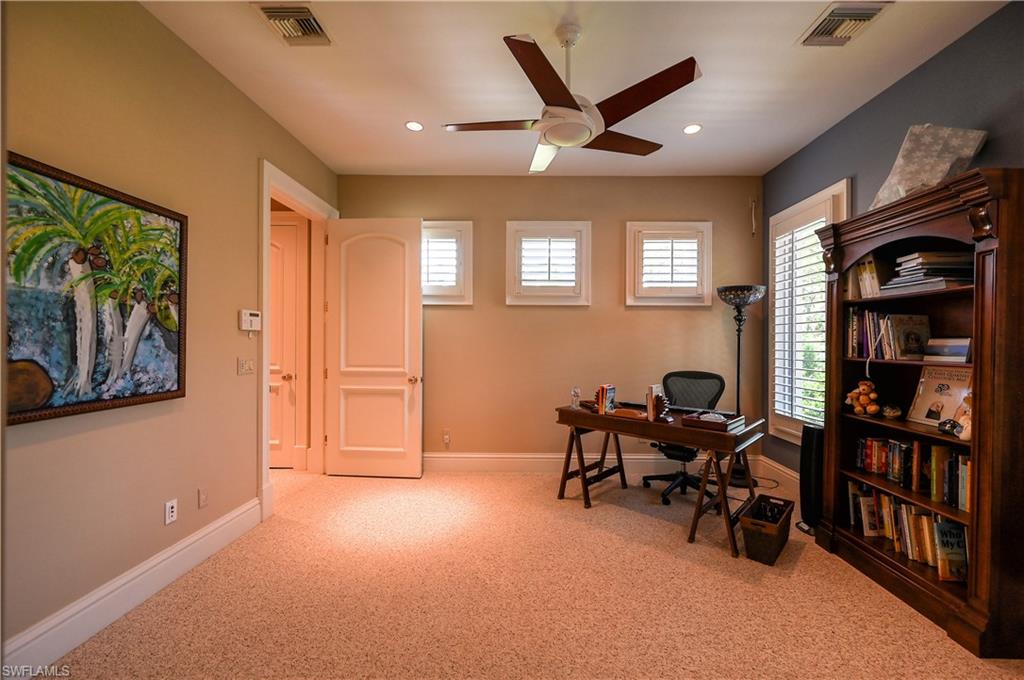 683 Hickory Road Naples, FL 34108 - Photo 33 of 42 a view of a livingroom with workspace and a window
