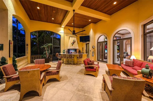a lobby with furniture and a flat screen tv