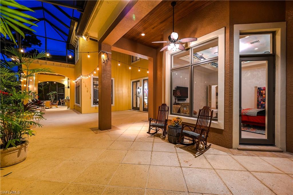 683 Hickory Road Naples, FL 34108 - Photo 42 of 42 a lobby with furniture and a flat screen tv