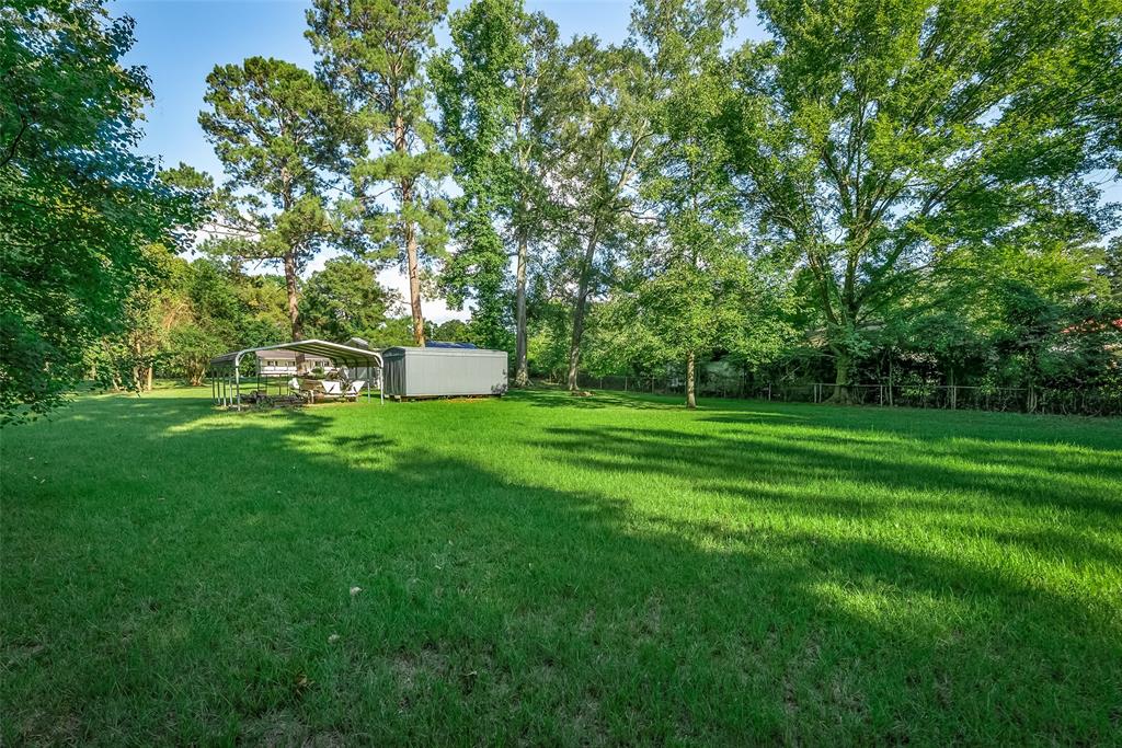 224 Prysock Road Doyline, LA 71023 - Photo 30 of 39 View of yard with a carport and view of scattered trees