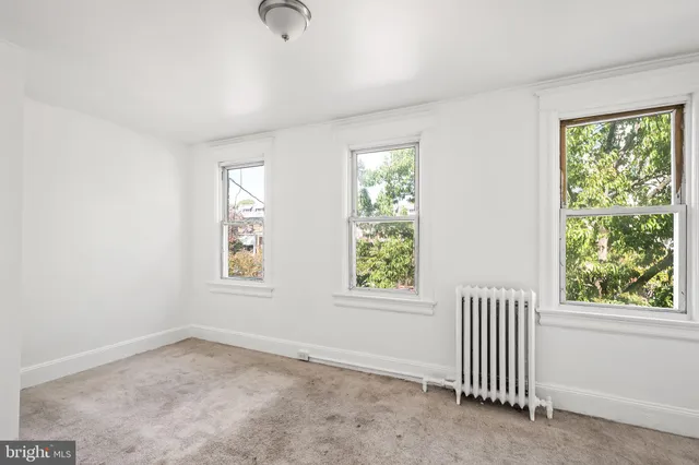 an empty room with windows