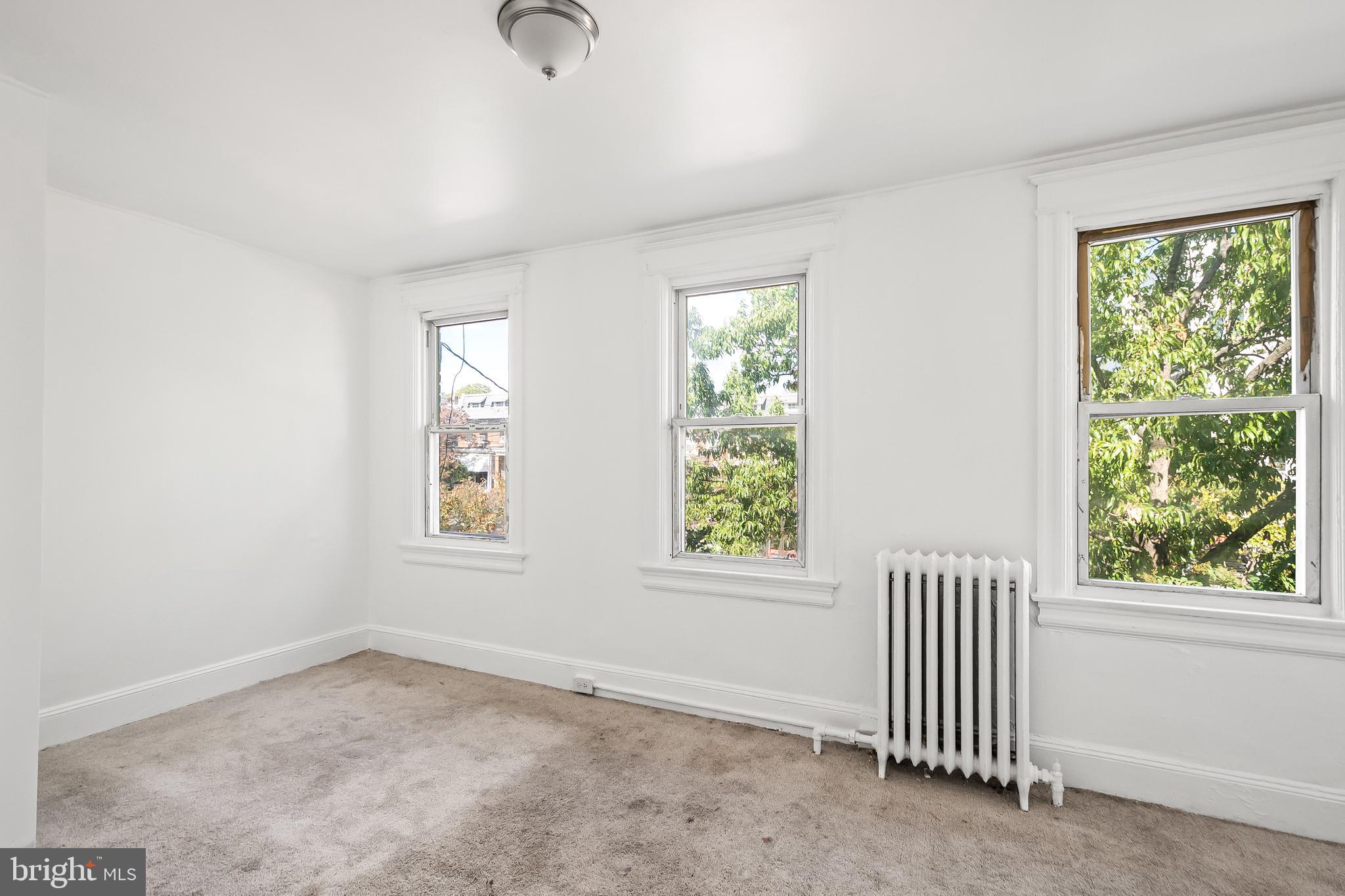 1214 Kennedy Street Northwest Washington, DC 20011 - Photo 14 of 34 an empty room with windows