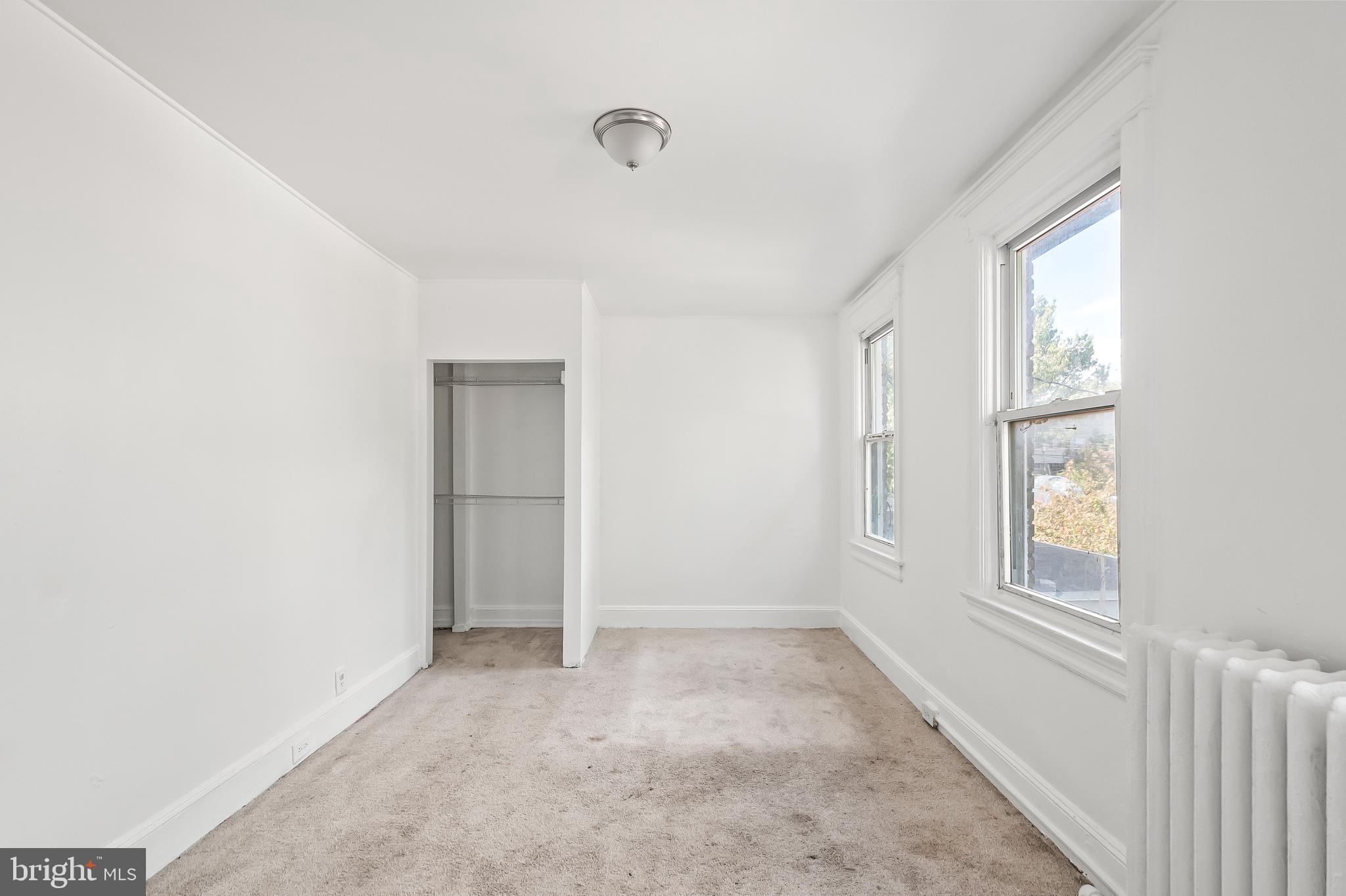 1214 Kennedy Street Northwest Washington, DC 20011 - Photo 16 of 34 a view of an empty room with a window