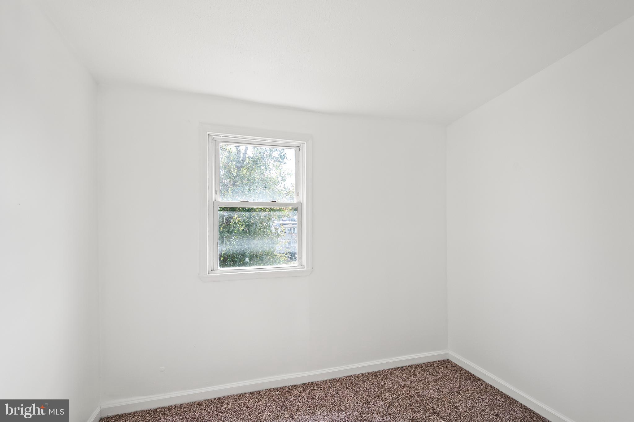1214 Kennedy Street Northwest Washington, DC 20011 - Photo 17 of 34 an empty room with a window