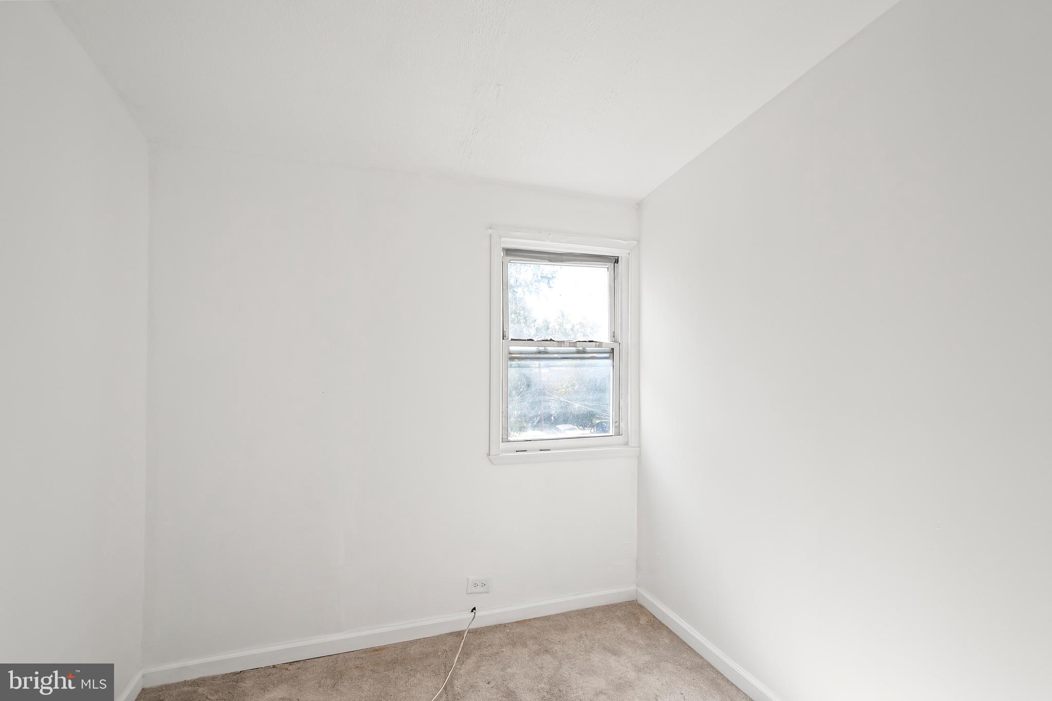 1214 Kennedy Street Northwest Washington, DC 20011 - Photo 18 of 34 an empty room with a window