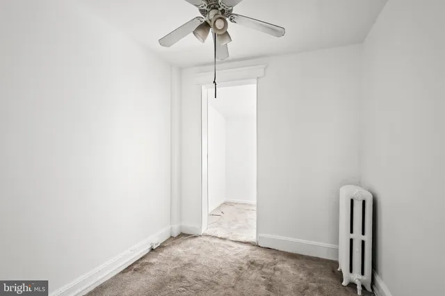 a view of empty room with fan