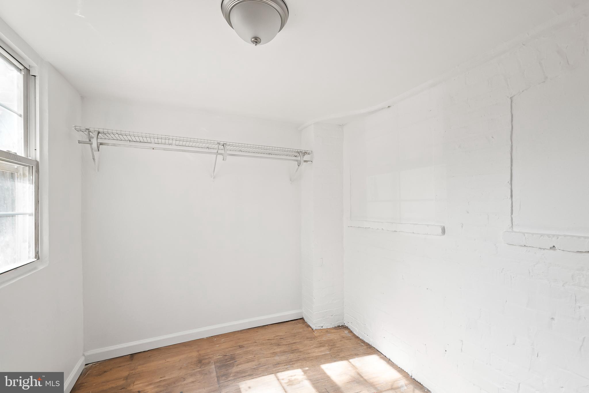 1214 Kennedy Street Northwest Washington, DC 20011 - Photo 26 of 34 a view of a room with racks on the wall