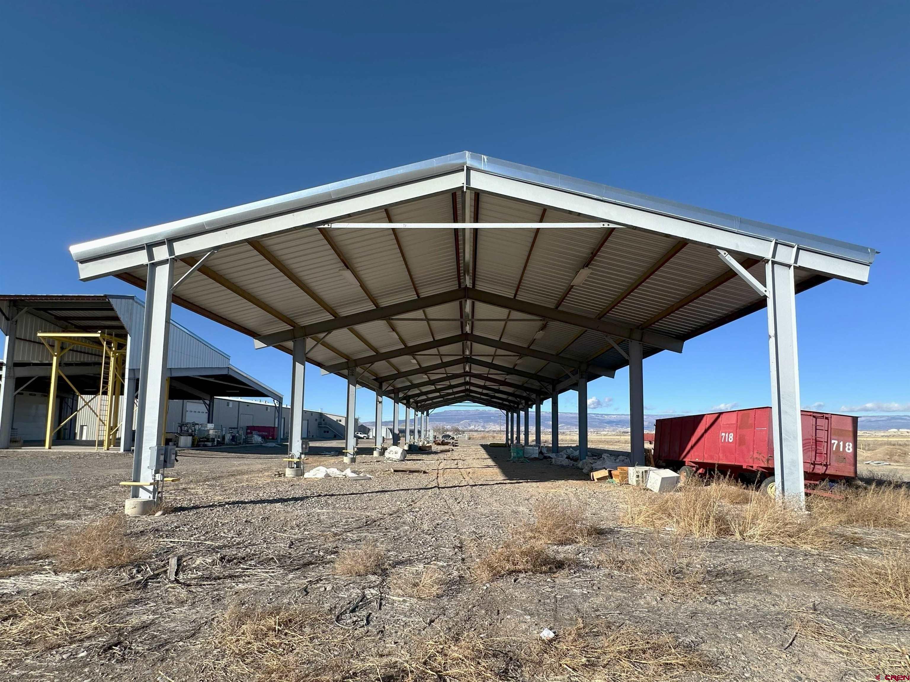 18668 B50 Road, Unit BUILDING F Delta, CO 81416 - Photo 3 of 7 a view of a car park with large trees