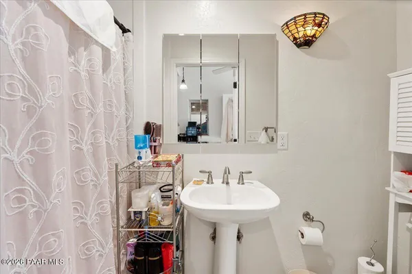 a bathroom with a sink and a mirror