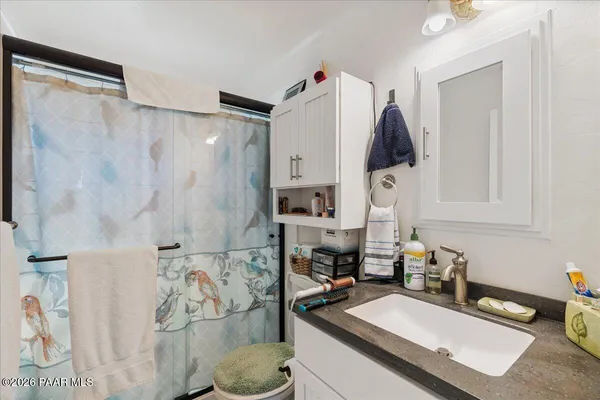 a kitchen with a sink a stove and a refrigerator