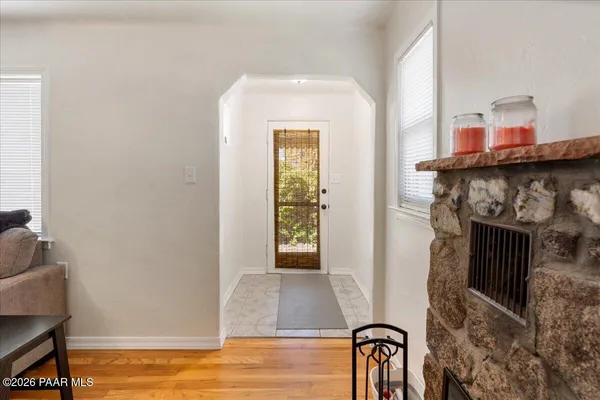 a view of an entryway with wooden floor