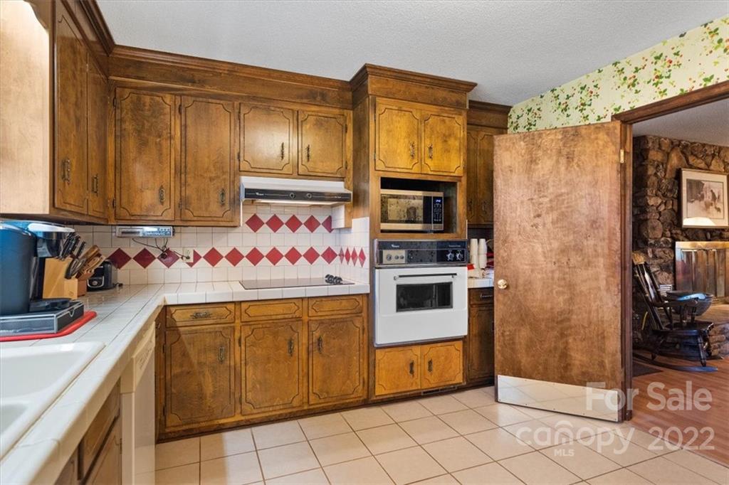 1552 Allen Lane Conover, NC 28613 - Photo 13 of 38 a kitchen with stainless steel appliances a stove a sink and a refrigerator