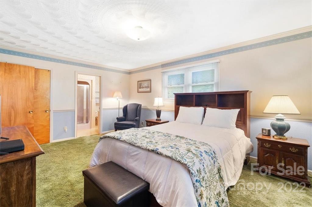 1552 Allen Lane Conover, NC 28613 - Photo 17 of 38 a bedroom with a bed and wooden floor