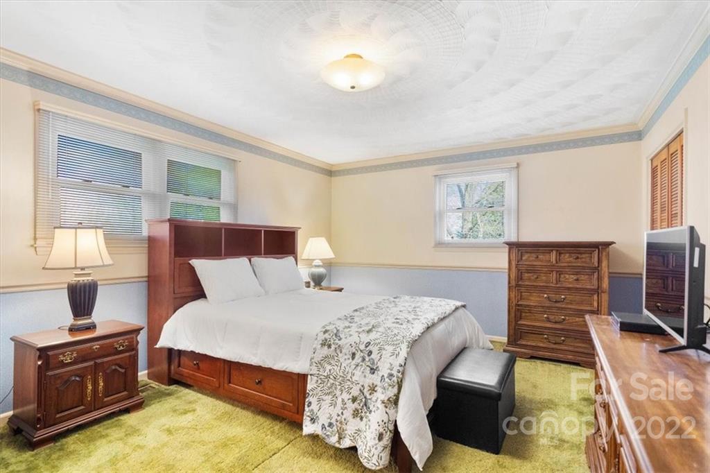 1552 Allen Lane Conover, NC 28613 - Photo 18 of 38 a bedroom with a bed and wooden floor