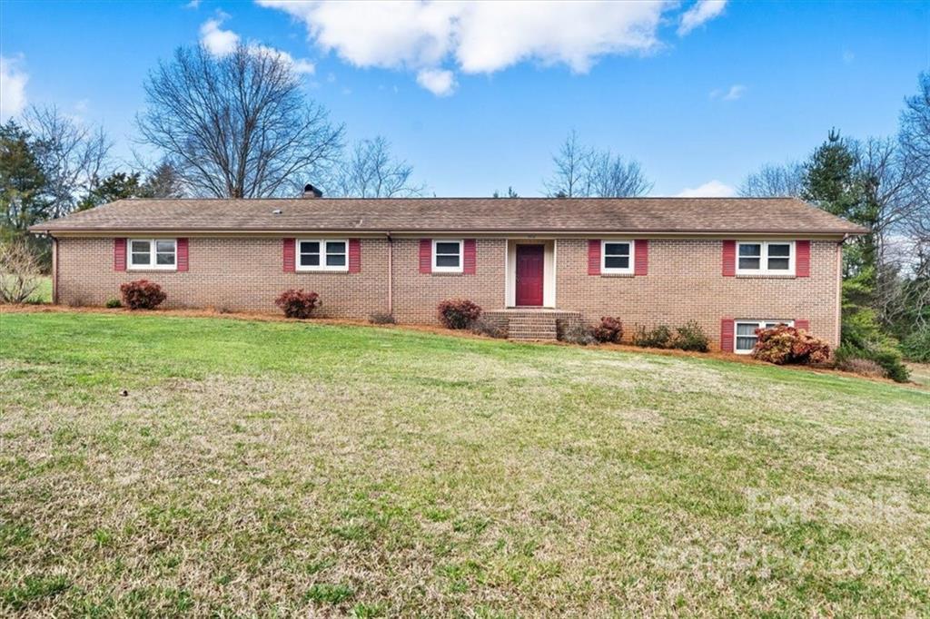1552 Allen Lane Conover, NC 28613 - Photo 2 of 38 a front view of a house with a garden and yard