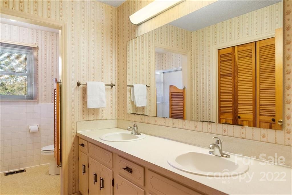 1552 Allen Lane Conover, NC 28613 - Photo 23 of 38 a bathroom with a sink double vanity and a mirror