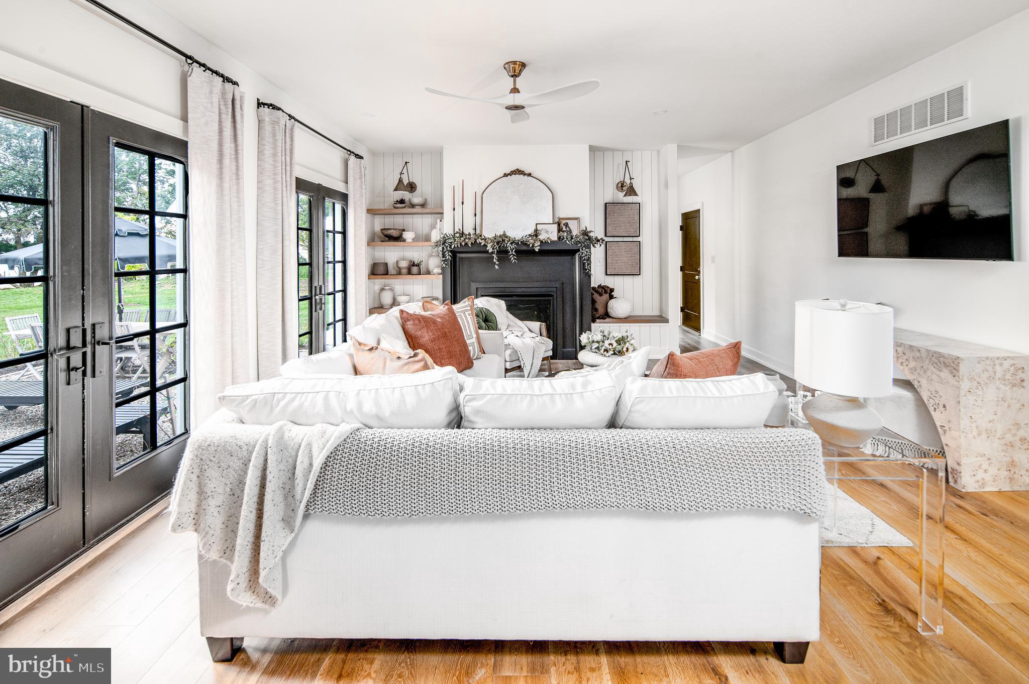 4 Timber Mill Lane, Unit OMBRA Landenberg, PA 19350 - Photo 14 of 33 a living room with fireplace furniture and a flat screen tv