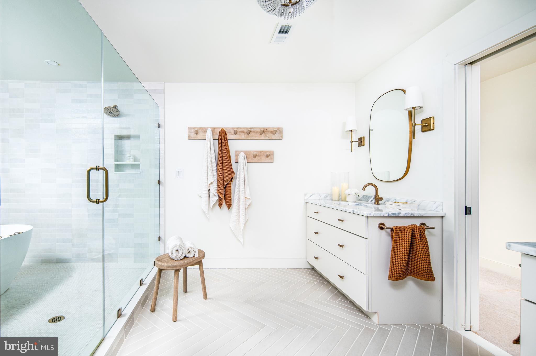 4 Timber Mill Lane, Unit OMBRA Landenberg, PA 19350 - Photo 22 of 33 a bathroom with a tub sink and mirror