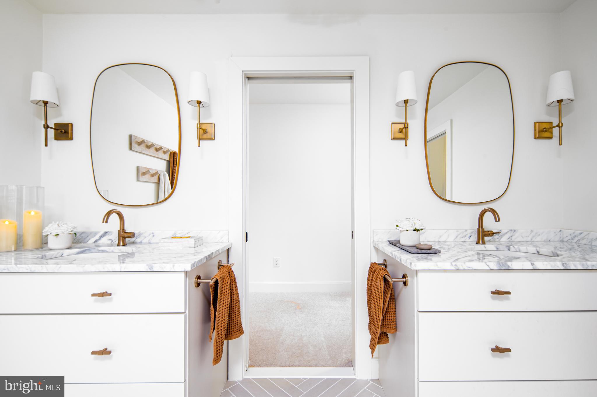 4 Timber Mill Lane, Unit OMBRA Landenberg, PA 19350 - Photo 23 of 33 a bathroom with a sink and a mirror