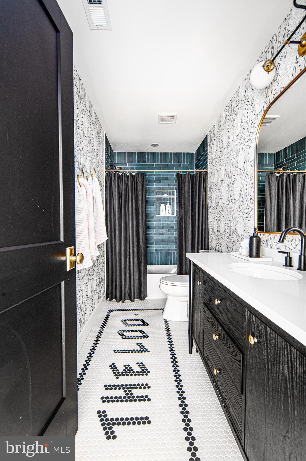 4 Timber Mill Lane, Unit OMBRA Landenberg, PA 19350 - Photo 29 of 33 a bathroom with a sink mirror and a shower