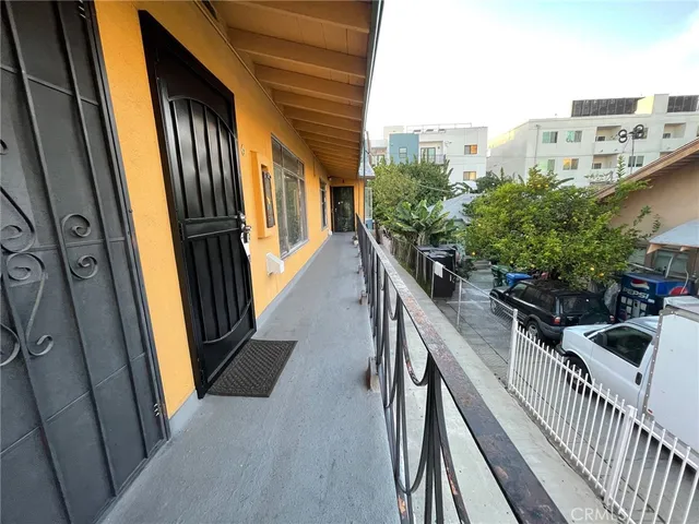 a view of balcony and yard