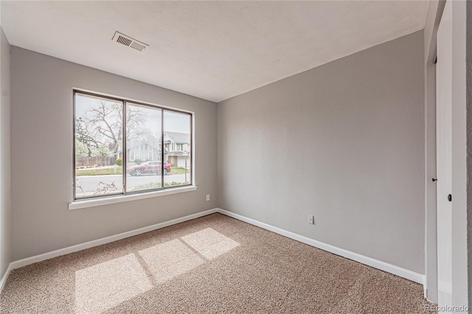 10091 Yates Street Westminster, CO 80031 - Photo 16 of 40 an empty room with a window