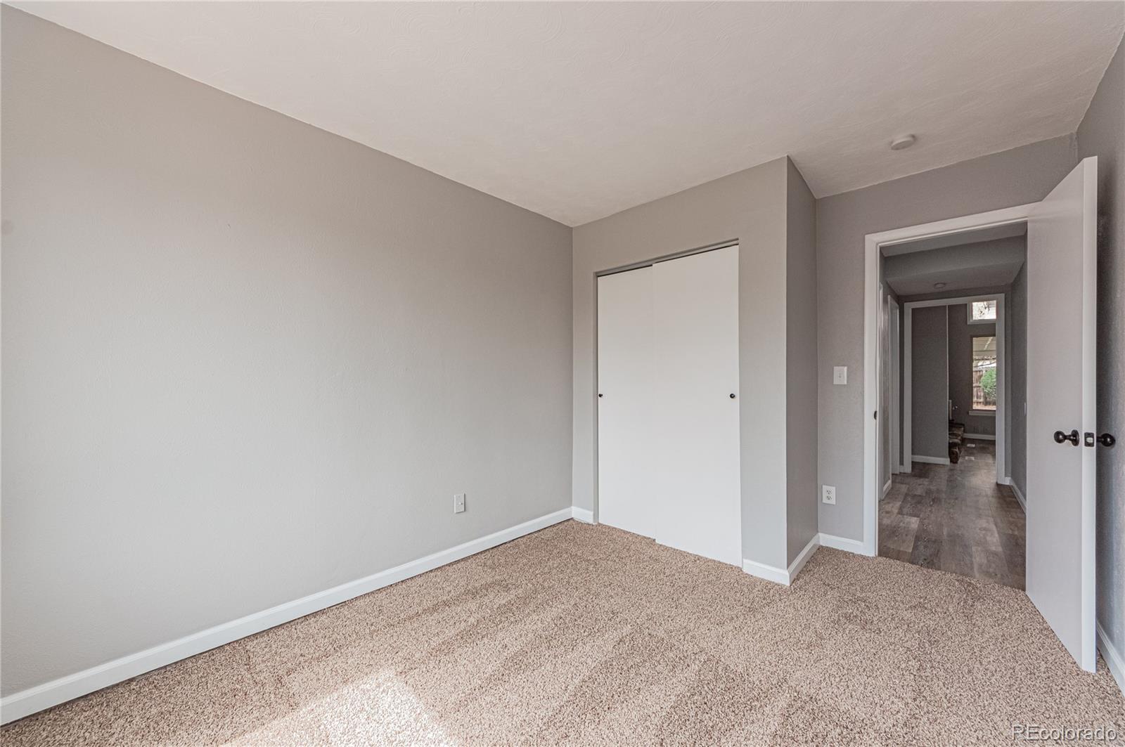 10091 Yates Street Westminster, CO 80031 - Photo 17 of 40 a view of a big room with closet and mirror