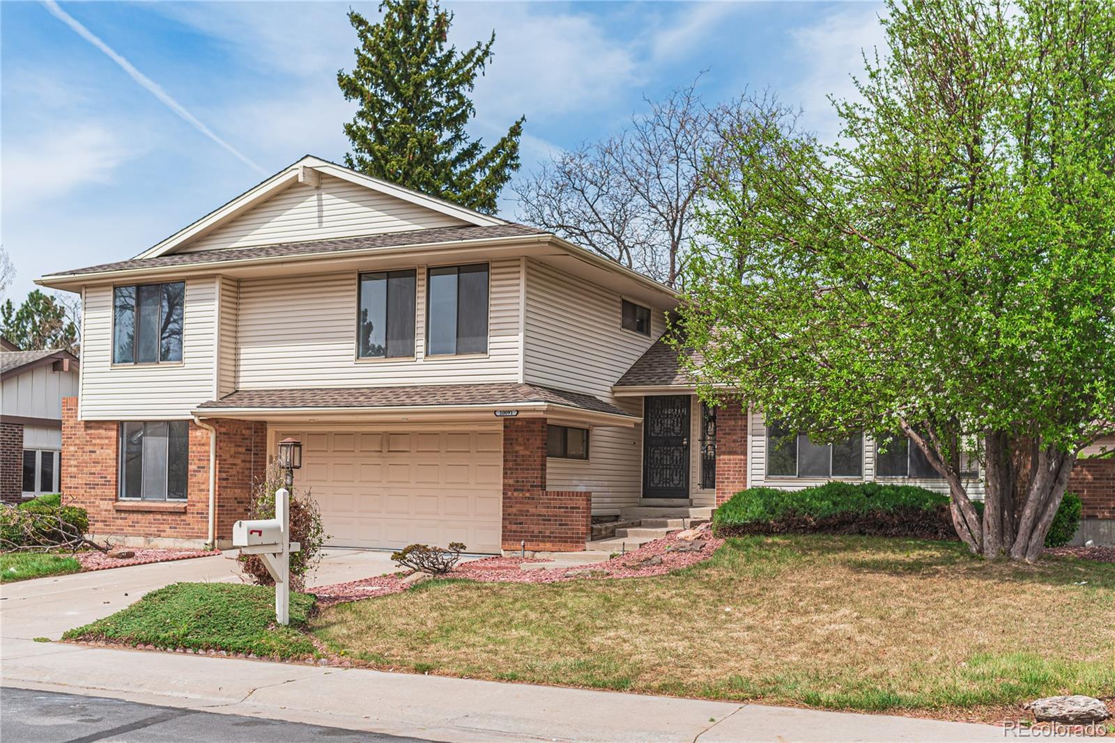 10091 Yates Street Westminster, CO 80031 - Photo 2 of 40 a front view of a house with garden