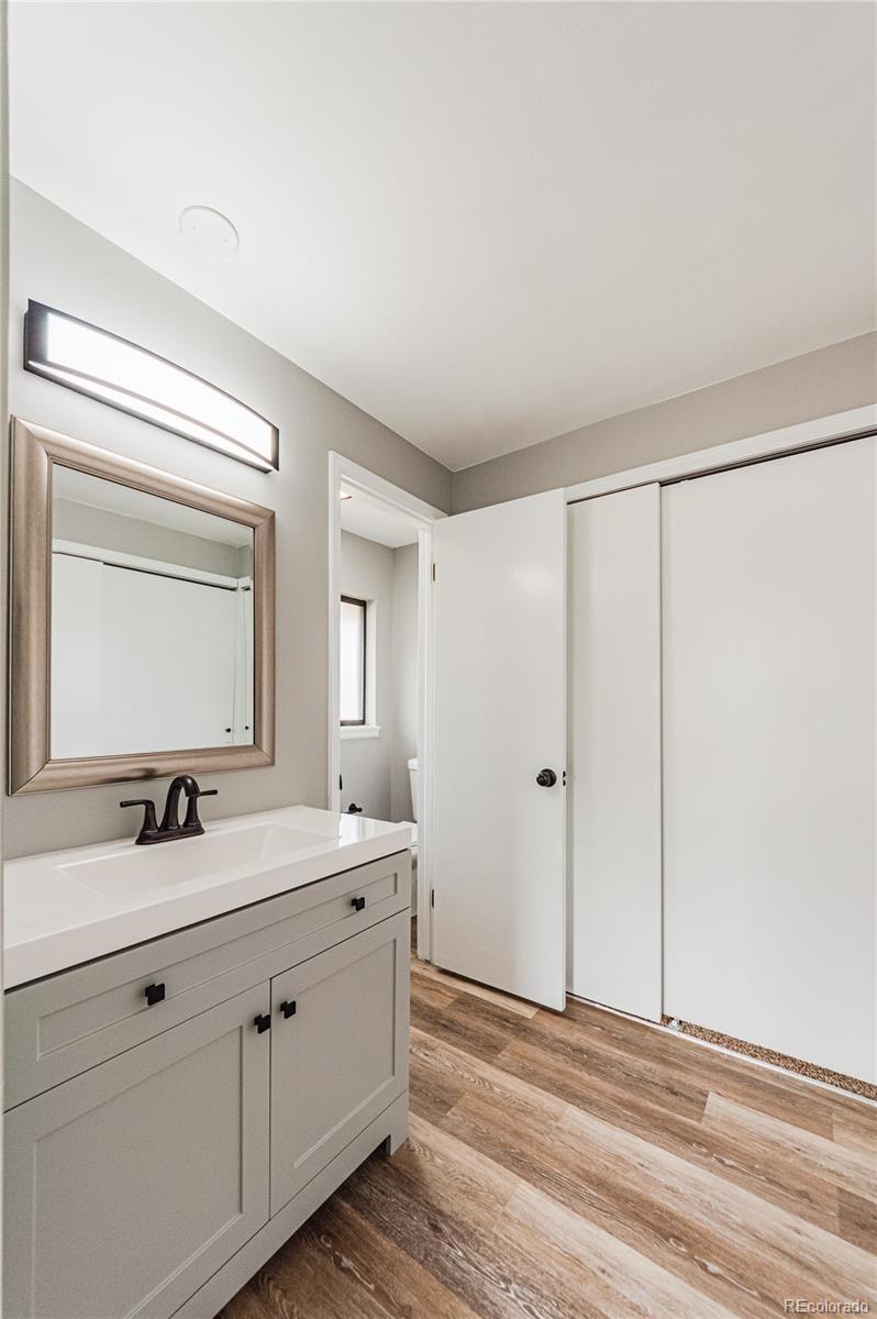 10091 Yates Street Westminster, CO 80031 - Photo 23 of 40 a bathroom with a double vanity sink and mirror
