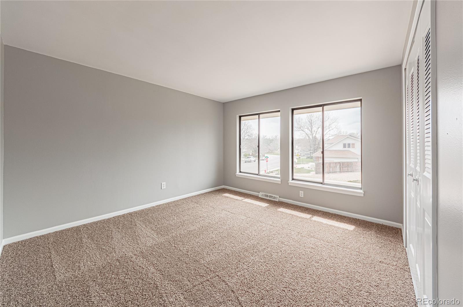 10091 Yates Street Westminster, CO 80031 - Photo 26 of 40 an empty room with windows